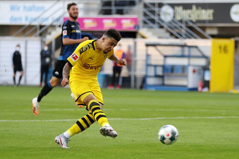 FILE PHOTO: Soccer Football - Bundesliga - SC Paderborn v Borussia Dortmund - Benteler Arena, Paderborn, Germany - May 31, 2020 Borussia Dortmund's Jadon Sancho scores their sixth goal, as play resumes behind closed doors following the outbreak of the cor