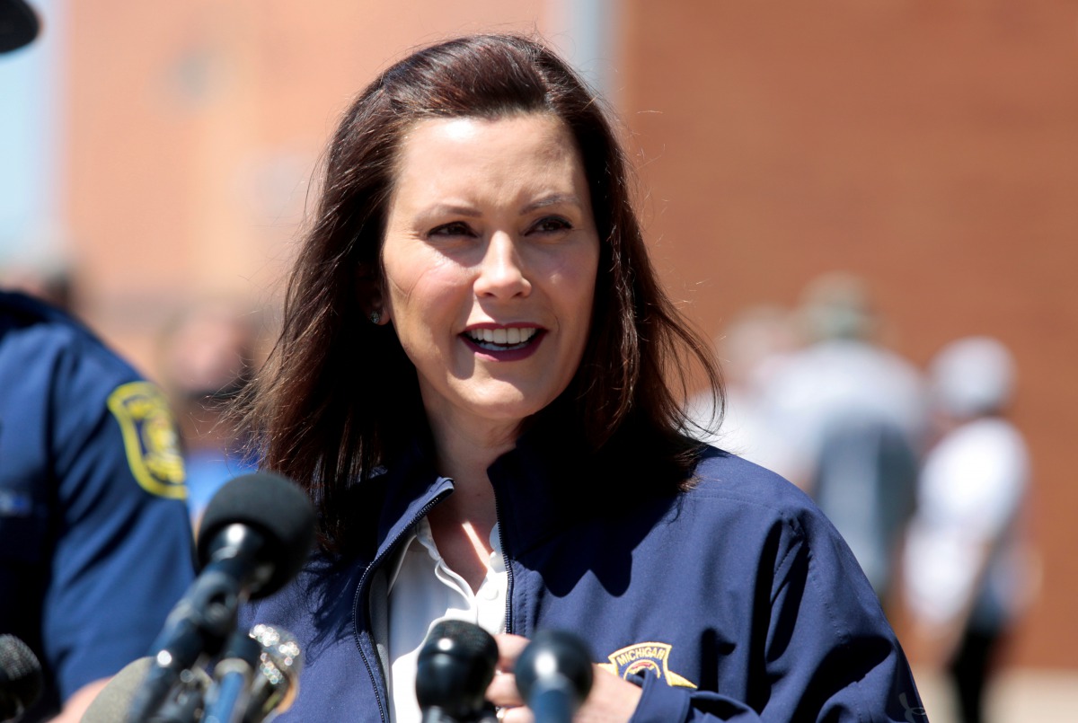 FILE PHOTO: Michigan Governor Gretchen Whitmer addresses the media about the flooding along the Tittabawassee River, after several dams breached, in downtown Midland, Michigan, U.S., May 20, 2020. REUTERS/Rebecca Cook/File Photo
