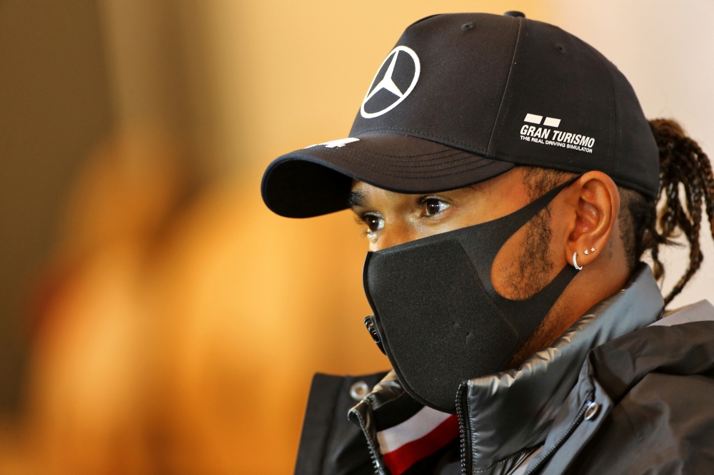 Formula One F1 - Eifel Grand Prix - Nurburgring, Nurburg, Germany - October 8, 2020 Mercedes' Lewis Hamilton wearing a protective face mask during a press conference ahead of the Eifel Grand Prix FIA/Handout via REUTERS
