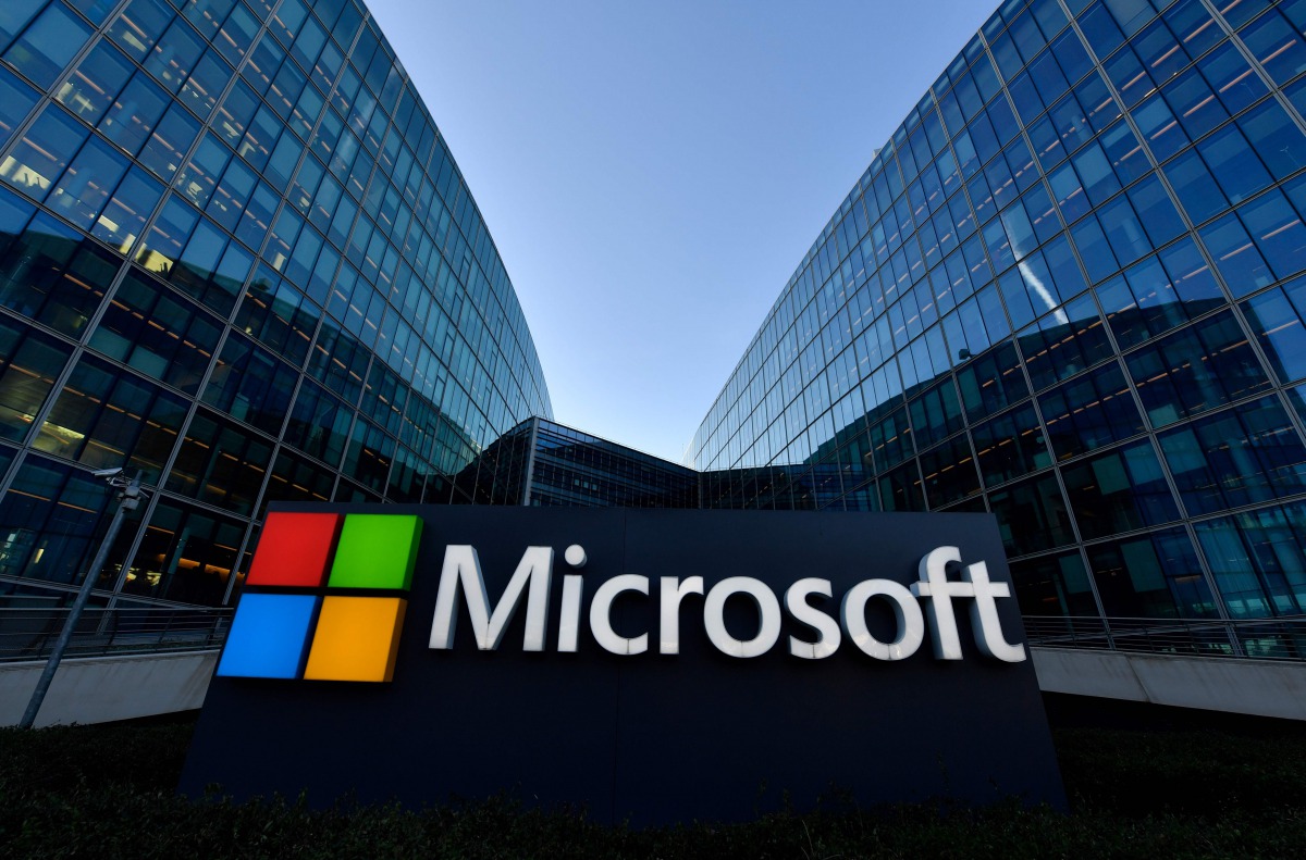 (FILES) In this file photo taken on March 5, 2018 the logo of French headquarters of American multinational technology company Microsoft, is pictured in Issy-Les-Moulineaux, a Paris suburb. / AFP / GERARD JULIEN
