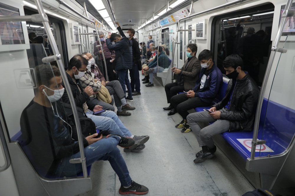 Iranian commuters wear face masks in a metro after Iranian authorities made it mandatory for all to wear face masks in public following the outbreak of the coronavirus disease (COVID19), in Tehran Iran October 10, 2020. Majid Asgaripour/WANA 