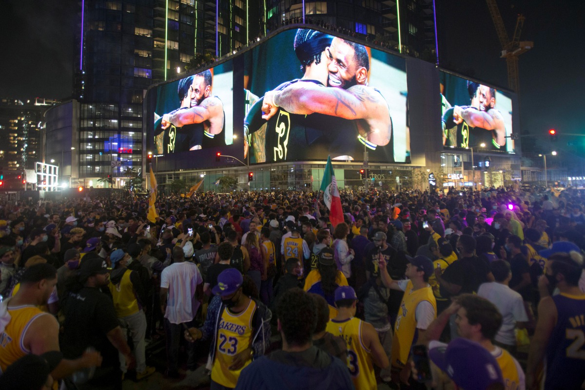 Lakers fans celebrate their team winning the 2020 NBA Championship during the COVID-19 pandemic in Los Angeles, California, U.S., October 11, 2020. REUTERS/Ringo Chiu
