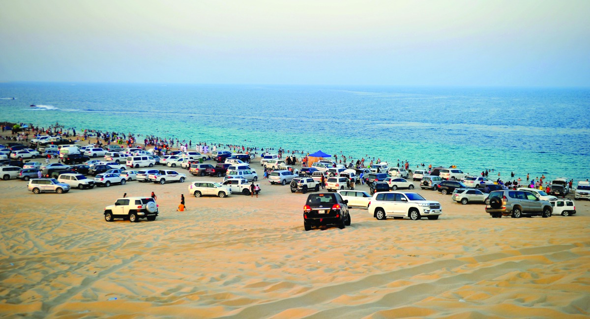 People enjoying the pleasant weather at Sealine beach. Pic: Abdul Basit/The Peninsula