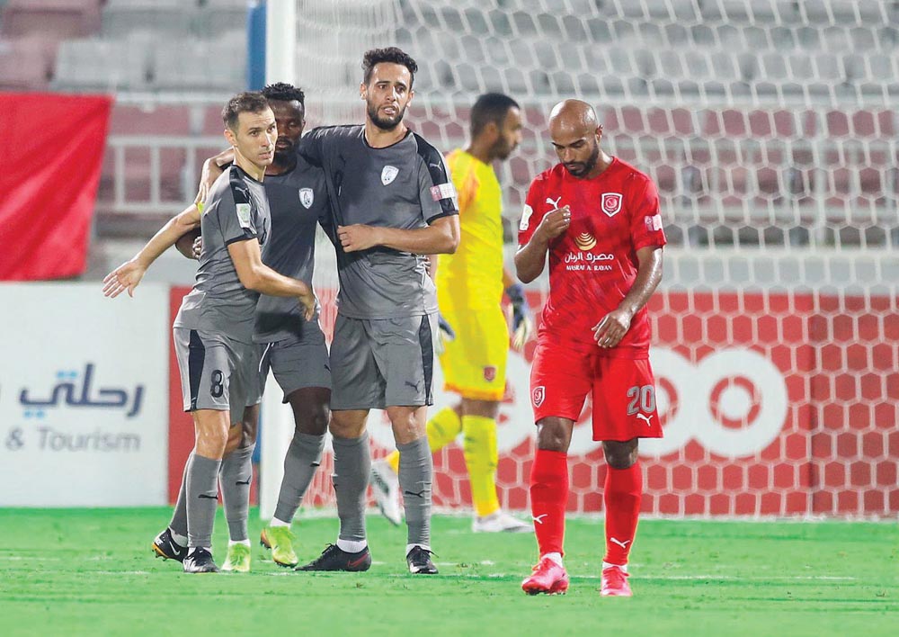 Al Wakrah players celebrate their victory next to dejected Al Afif of Al Duhail at the Al Duhail Stadium, yesterday.