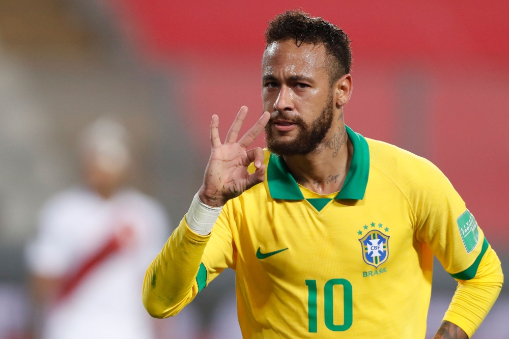 Brazil's Neymar celebrates after scoring against Peru during their 2022 FIFA World Cup South American qualifier football match at the National Stadium in Lima, on October 13, 2020, amid the COVID-19 novel coronavirus pandemic. / AFP / POOL / Paolo Aguilar