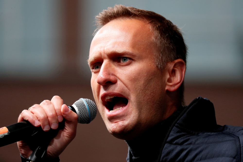 FILE PHOTO: Russian opposition leader Alexei Navalny delivers a speech during a rally to demand the release of jailed protesters, who were detained during opposition demonstrations for fair elections, in Moscow, Russia September 29, 2019/File Photo/File P