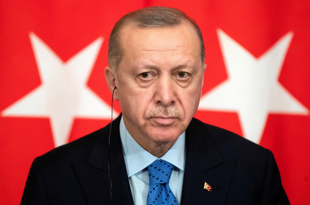 FILE PHOTO: Turkish President Tayyip Erdogan attends a news conference during a visit to Moscow, Russia, March 5, 2020. Pavel Golovkin/Pool via REUTERS
