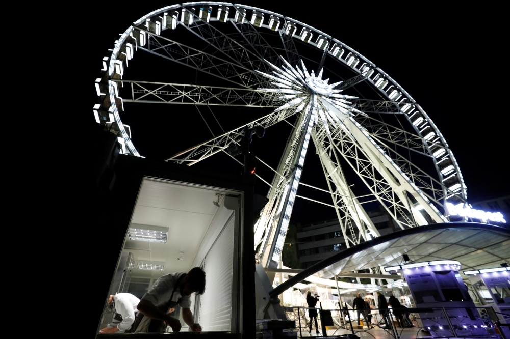 A chef prepares food as Michelin-starred restaurant Costes moves into the Budapest Eye ferris wheel during the outbreak of the coronavirus disease (COVID-19), in Budapest, Hungary, October 17, 2020. Picture taken October 17, 2020. REUTERS/Bernadett Szabo