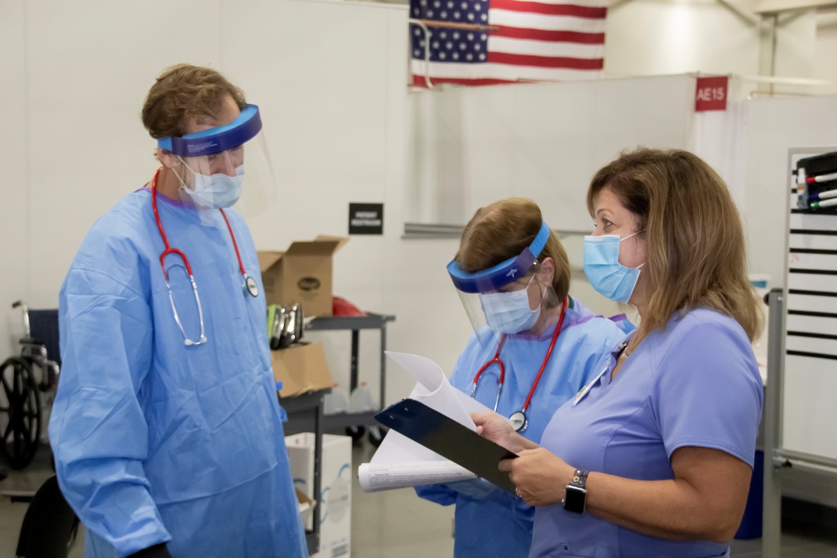 Medical personnel work inside a field hospital known as an Alternate Care Facility at the state fair ground as cases of coronavirus disease (COVID-19) cases spike in the state near Milwaukee, Wisconsin, U.S., October 12, 2020. Picture taken October 12, 20