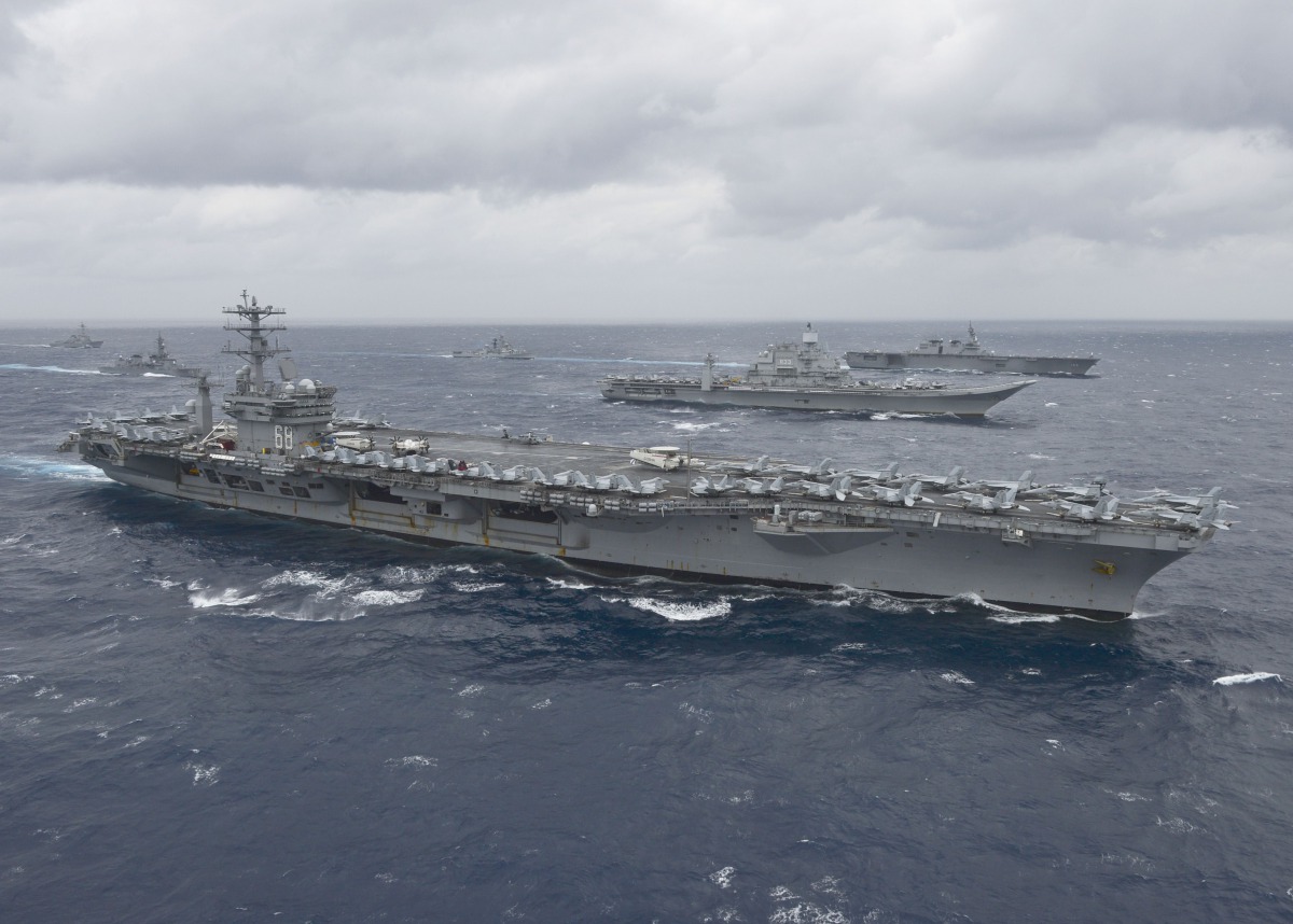 (FILES) In this file photo taken on July 18, 2017 this US Navy handout photo obtained July 18, 2017 shows the aircraft carrier USS Nimitz (CVN 68)as it leads a formation of ships from the Indian navy, Japan Maritime Self-Defense Force (JMSDF) and the US N