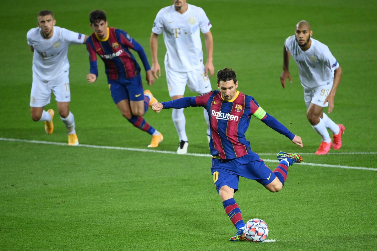 Barcelona's Argentine forward Lionel Messi scores a penalty during the UEFA Champions League football match between FC Barcelona and Ferencvarosi TC at the Camp Nou stadium in Barcelona on October 20, 2020. / AFP / LLUIS GENE