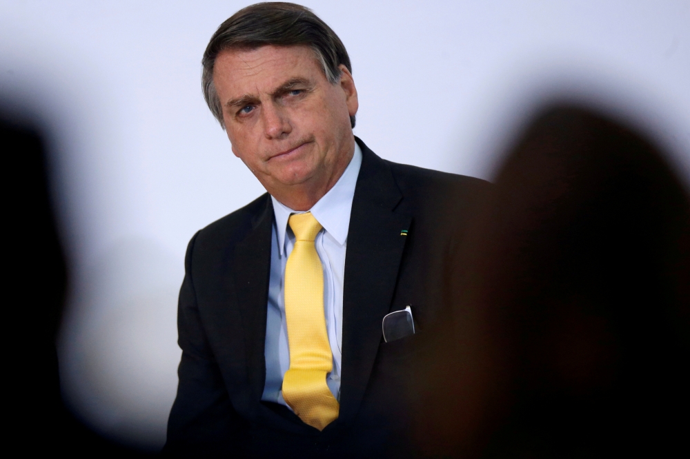 Brazil's President Jair Bolsonaro looks on during the COVID-19 Clinical Study Result Announcement Ceremony at the Planalto Palace in Brasilia, Brazil, October 19, 2020. REUTERS/Adriano Machado/File Photo
