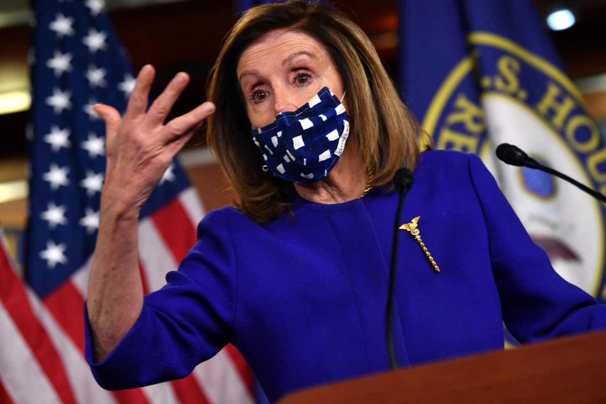 (FILES) In this file photo taken on October 09, 2020 US Speaker of the House, Nancy Pelosi, Democrat of California, speaks to the press on Capitol Hill in Washington, DC. House Speaker Nancy Pelosi made progress in US stimulus negotiations with Treasury S