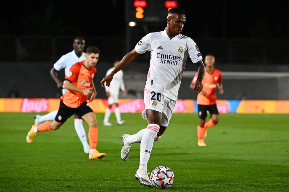 Real Madrid's Brazilian forward Vinicius Junior runs with the ball during the UEFA Champions League group B football match between Real Madrid and Shakhtar Donetsk at the Alfredo di Stefano stadium in Valdebebas on the outskirts of Madrid on October 21, 2