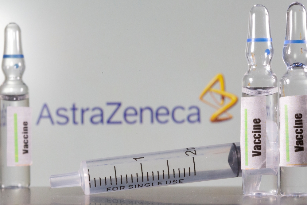 A test tube labelled vaccine is seen in front of AstraZeneca logo in this illustration taken, September 9, 2020. REUTERS/Dado Ruvic/Illustration/File Photo/File Photo
