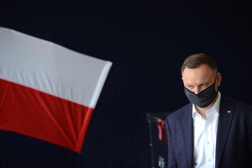 (FILES) In this file photo taken on June 28, 2020, Polish President Andrzej Duda arrives at a polling station to take part in a voting during Poland's Presidental election in Krakow, Poland. Poland's President Andrzej Duda has tested positive for coronavi