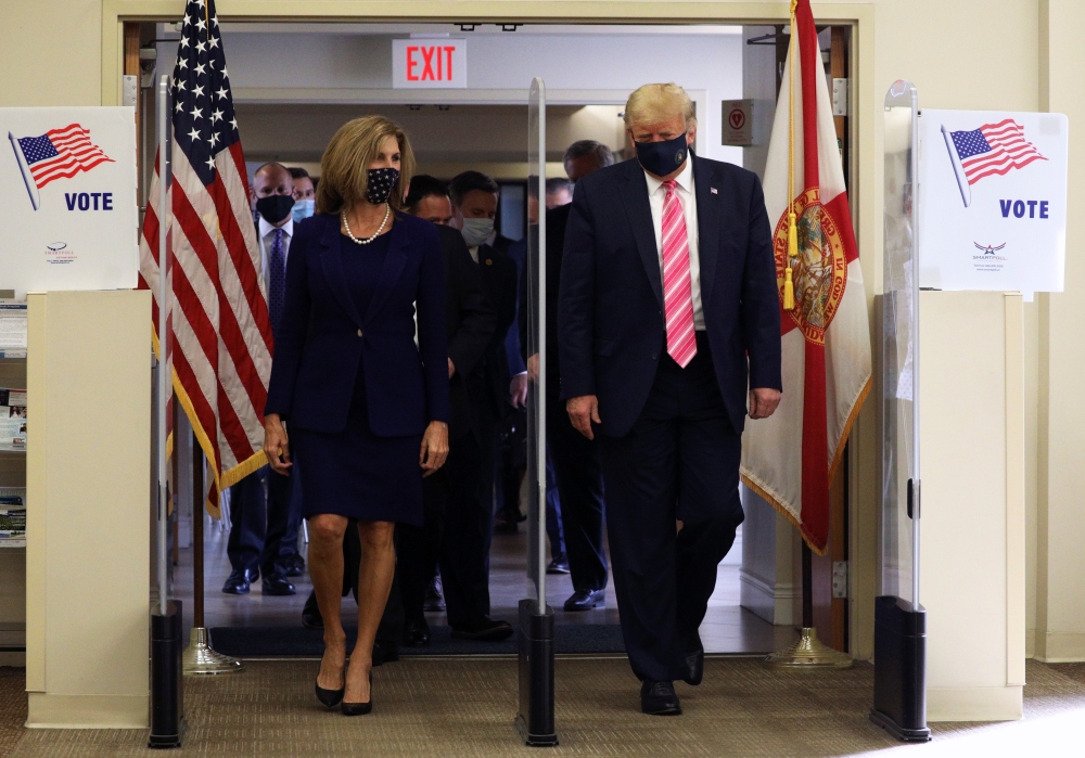 US President Donald Trump wearing a face mask leaves after voting in the 2020 presidential election at the Palm Beach County Library in West Palm Beach, U.S., October 24, 2020. (REUTERS/Tom Brenner)