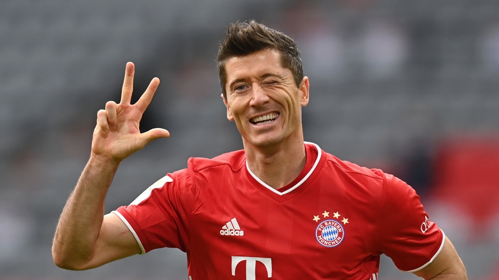 Bayern Munich's Polish forward Robert Lewandowski celebrates scoring the 3-0 goal for his hat-trick during the German first division Bundesliga football match between FC Bayern Munich and Eintracht Frankfurt on October 24, 2020 in Munich, southern Germany