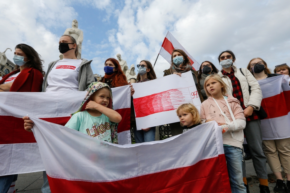 Demonstrators attend a rally in solidarity with Belarusian opposition supporters, who hold protests to reject the presidential election results and to demand the release of political prisoners in Belarus, in central Kyiv, Ukraine October 24, 2020. REUTERS
