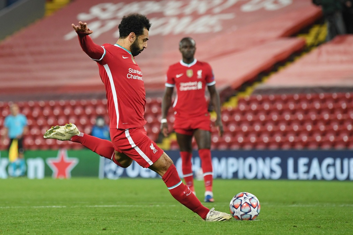 Soccer Football - Champions League - Group D - Liverpool v FC Midtjylland - Anfield, Liverpool, Britain - October 27, 2020 Liverpool's Mohamed Salah scores their second goal from the penalty spot Pool via REUTERS/Michael Regan
