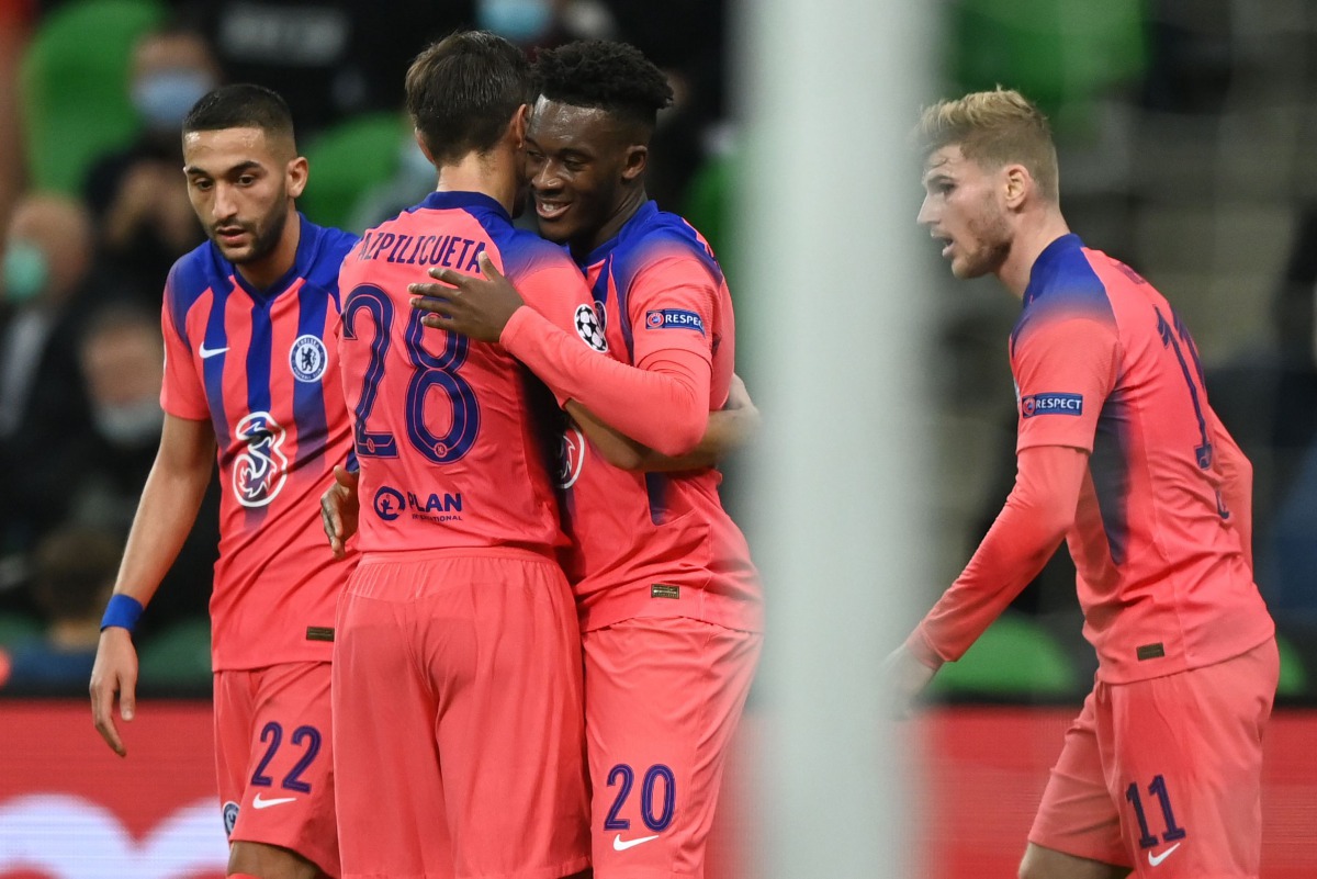Chelsea's English midfielder Callum Hudson-Odoi celebrates with teammates after scoring the opening goal during the UEFA Champions League football match between Krasnodar and Chelsea at the Krasnodar stadium in Krasnodar on October 28, 2020. / AFP / Kiril