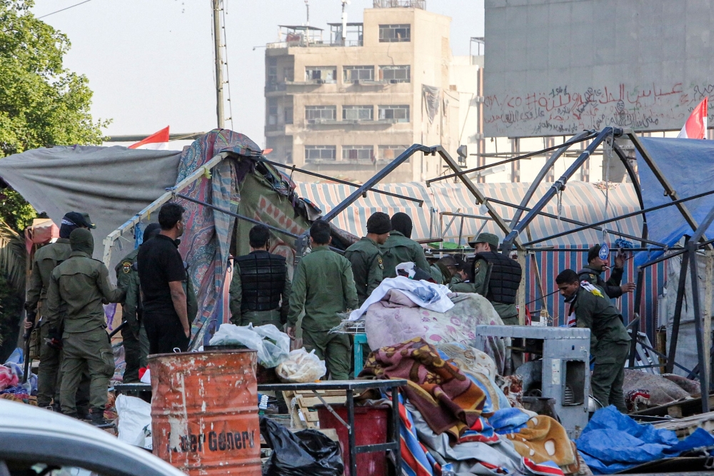 Members of the Iraqi security forces clear protesters' encampments during the reopening of the Iraqi capital Baghdad's central Tahrir Square on October 31, 2020. AFP / Sabah ARAR