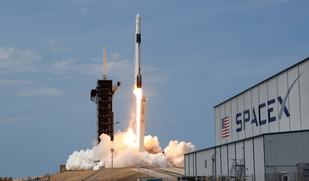 FILE PHOTO: A SpaceX Falcon 9 rocket and Crew Dragon spacecraft carrying NASA astronauts Douglas Hurley and Robert Behnken lifts off during NASA's SpaceX Demo-2 mission to the International Space Station from NASA's Kennedy Space Center in Cape Canaveral,