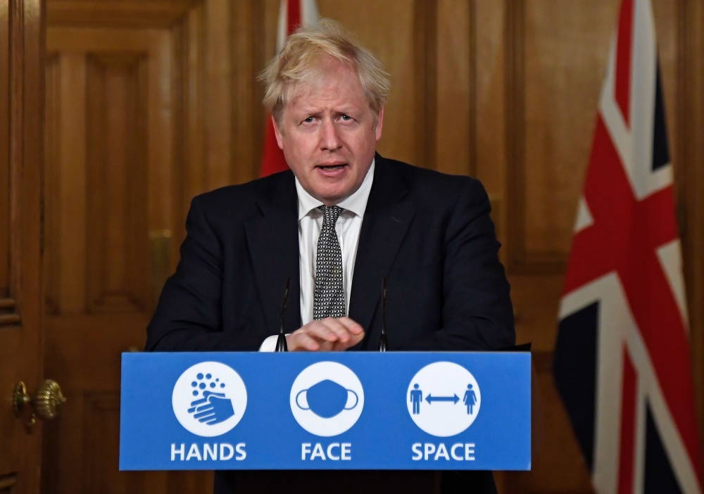 Britain's Prime Minister Boris Johnson speaks during a virtual press conference inside 10 Downing Street in central London on October 31, 2020 to announce new lockdown restrictions in an effort to curb rising infections of the novel coronavirus. AFP / Alb