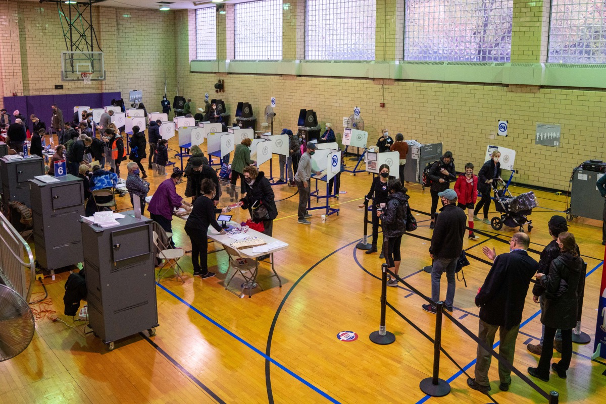 NEW YORK, NY - NOVEMBER 01: Voters cast their ballots at a polling station in Hunter-Bellevue School of Nursing polling station on November 1, 2020 in New York City. David Dee Delgado/AFP
