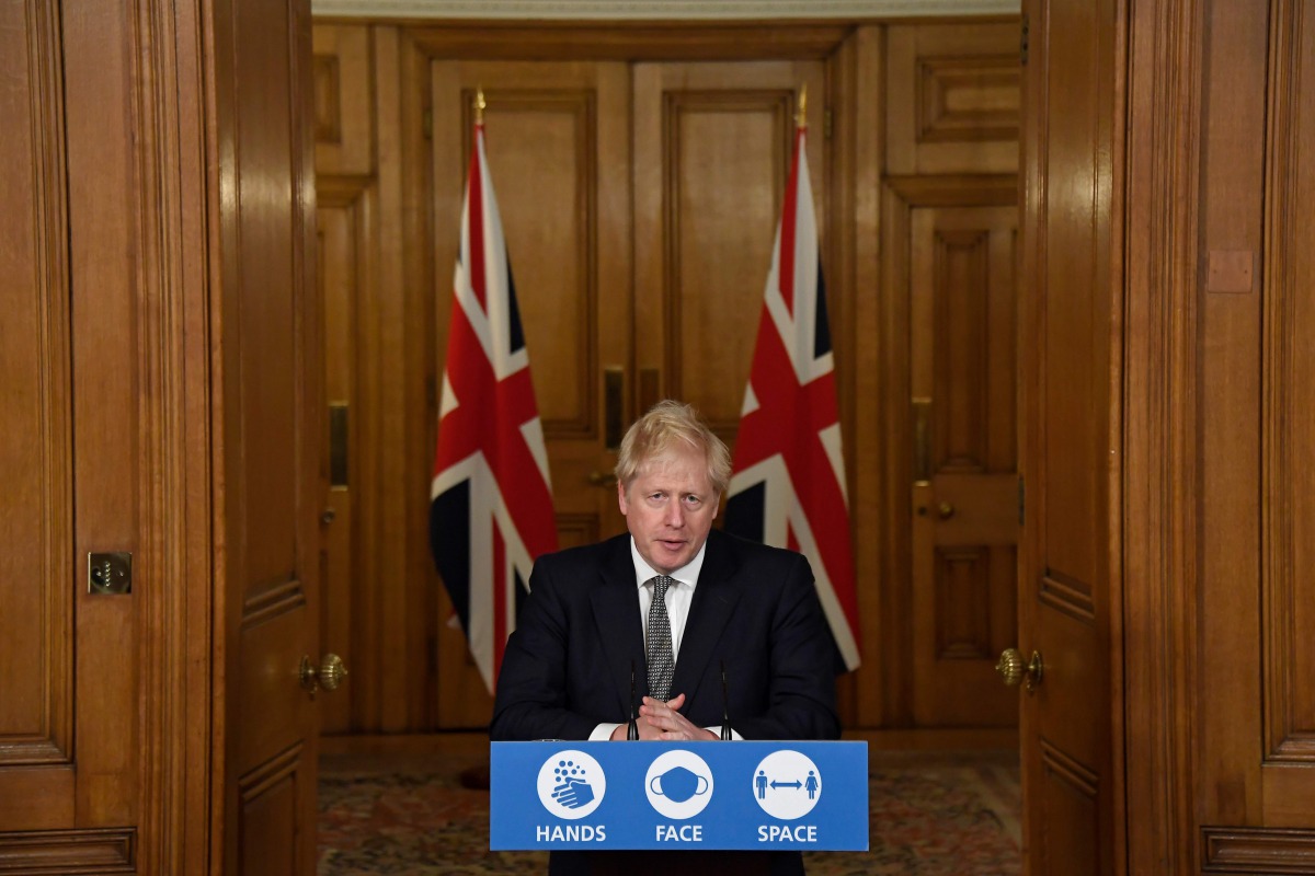 Britain's Prime Minister Boris Johnson speaks during a virtual press conference inside 10 Downing Street in central London on October 31, 2020 to announce new lockdown restrictions in an effort to curb rising infections of the novel coronavirus. / AFP / P