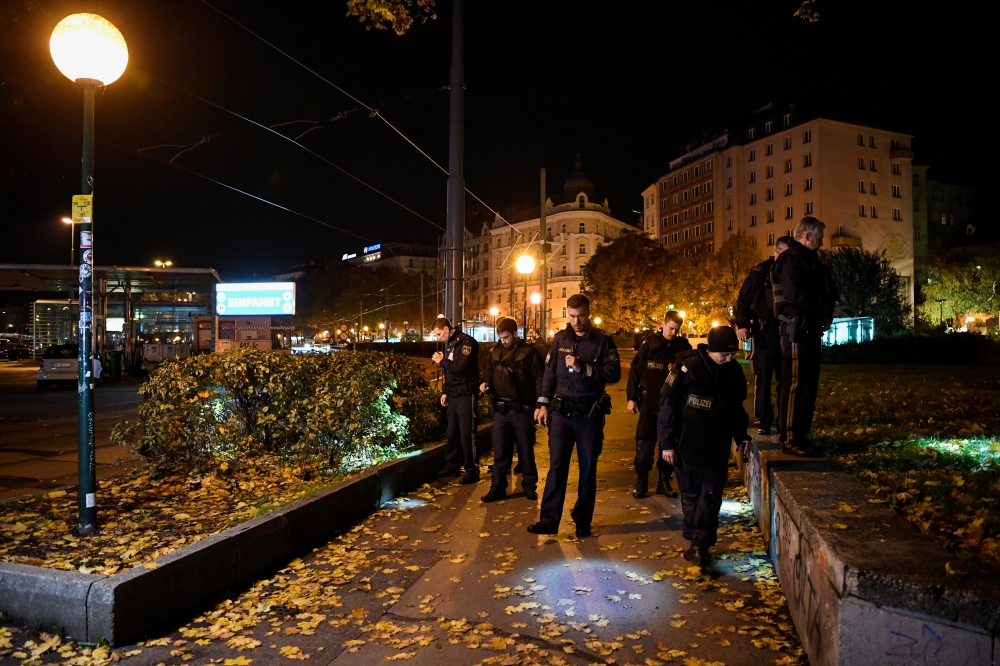 Police officers search in an area after exchanges of gunfire in Vienna, Austria November 3, 2020. REUTERS/Radovan Stoklasa