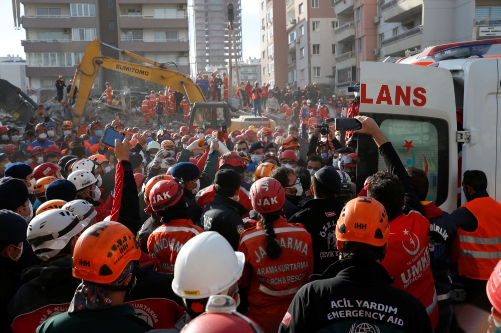 Rescuers carry 4-year-old Ayla Gezgin out from a collapsed building as operations take place on a site after an earthquake struck the Aegean Sea, in the coastal province of Izmir, Turkey, November 3, 2020. REUTERS/Kemal Aslan
