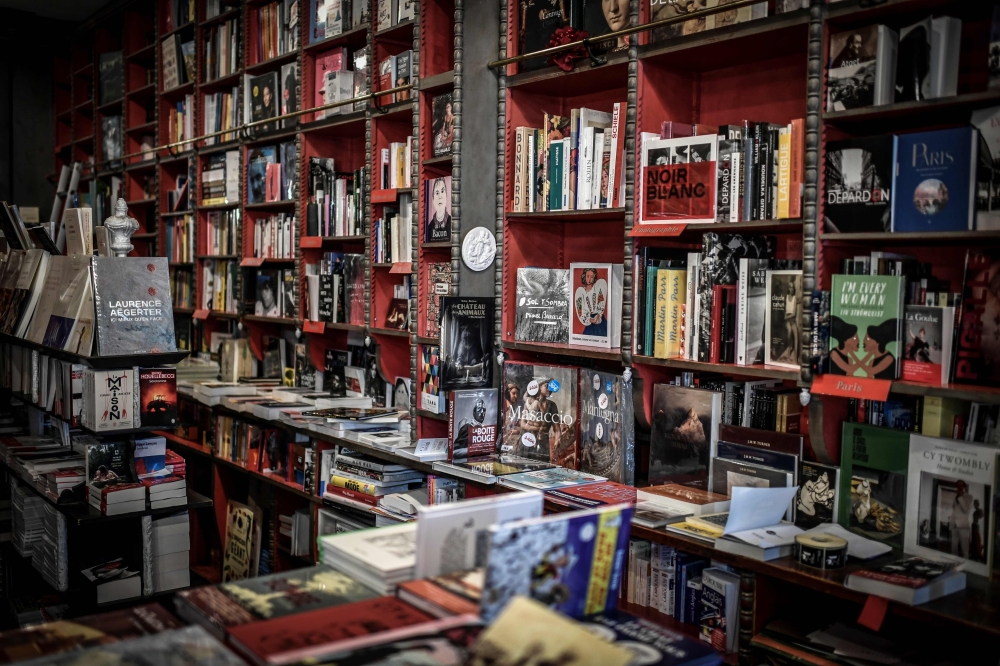 This photograph taken on November 2, 2020, shows books displayed at the Librairie des Abbesses bookstore in the Montmartre district in Paris on November 2, 2020, during the launch of 