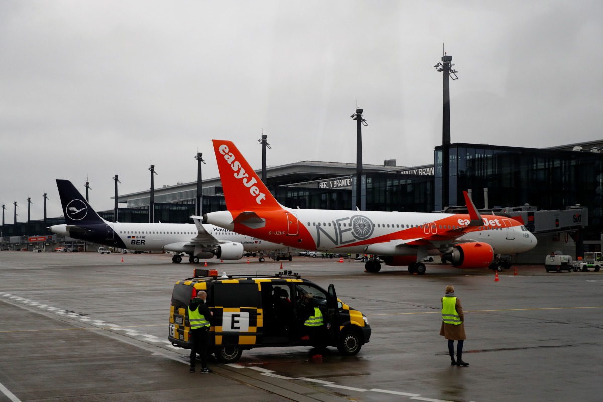 A Lufthansa aircraft and an EasyJet aircraft are seen after landing at Terminal 1, marking the official opening of the new Berlin-Brandenburg Airport (BER) 