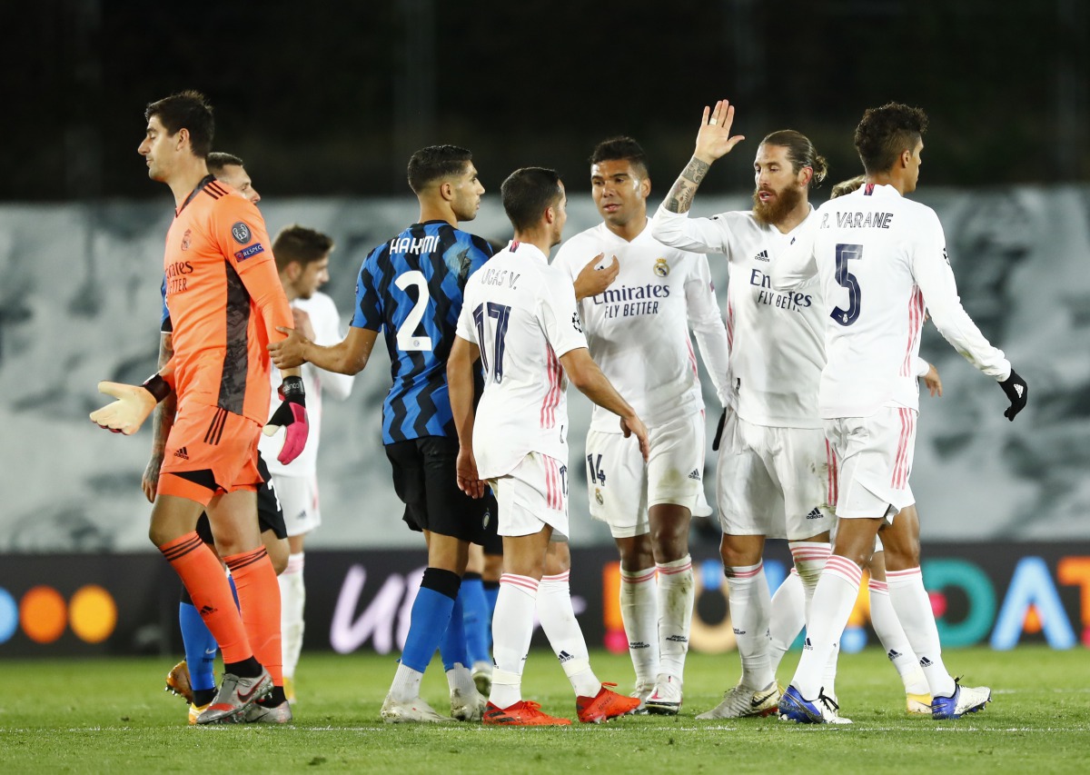 Soccer Football - Champions League - Group B - Real Madrid v Inter Milan - Estadio Alfredo Di Stefano, Madrid, Spain - November 3, 2020 Real Madrid's Sergio Ramos celebrates with teammates at the end of the match REUTERS/Juan Medina
