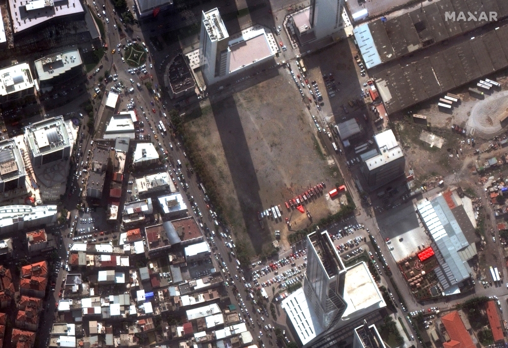 A satellite image shows rescue workers and a Turkish flag after the earthquake in Izmir, Turkey, November 3, 2020. Picture taken November 3, 2020. Satellite image ?2020 Maxar Technologies/Handout via REUTERS