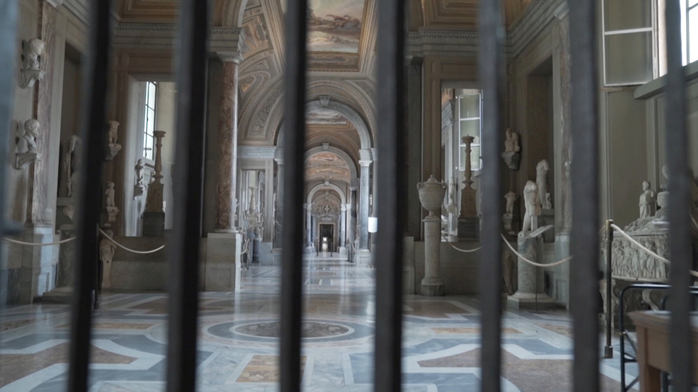 FILE PHOTO: An empty corridor inside Vatican Museums is seen through bars as staff prepare for reopening on June 1 with new social distancing and hygiene rules in this still image taken from an undated video in Vatican City. Musei Vaticani/Handout via Reu