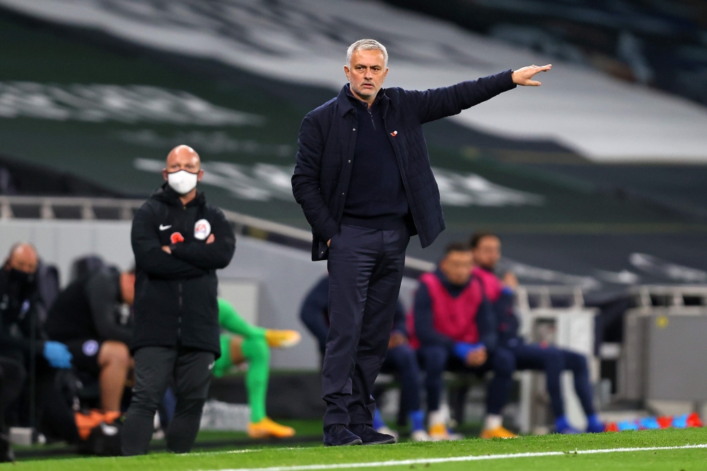 Tottenham Hotspur's Portuguese head coach Jose Mourinho (C) gestures from the sidelines during the English Premier League football match between Tottenham Hotspur and Brighton and Hove Albion at Tottenham Hotspur Stadium in London, on November 1, 2020.  /