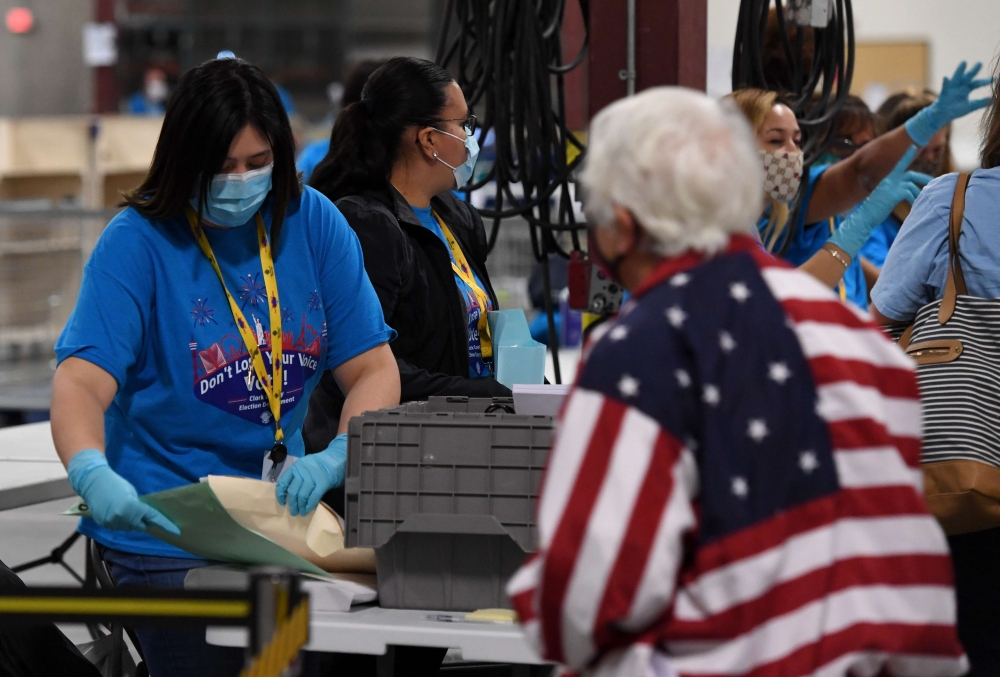Workers process polling place equipment and materials at the Clark County Election Department after polls closed on November 3, 2020 in North Las Vegas, Nevada. Ethan Miller /AFP