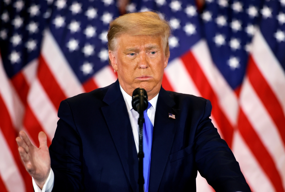 U.S. President Donald Trump gestures as he reacts to early results from the 2020 U.S. presidential election in the East Room of the White House in Washington, U.S., November 4, 2020. REUTERS/Carlos Barria
