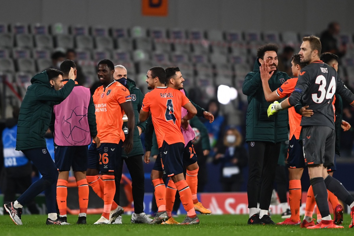 Istanbul Basaksehir FK players celebrates at the end of the UEFA Champions League football match group H, between Istanbul Basaksehir FK and Manchester United, on November 4, 2020, at the Basaksehir Fatih Terim stadium in Istanbul. / AFP / OZAN KOSE
