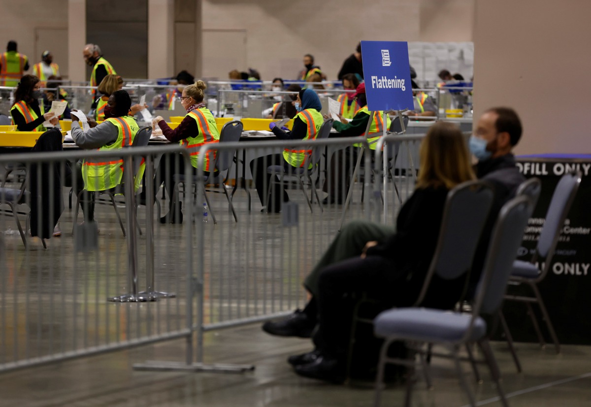 poll watchers observe as votes are counted at the Pennsylvania Convention Center on Election Day in Philadelphia, Pennsylvania, U.S. November 3, 2020. REUTERS/Rachel Wisniewski

