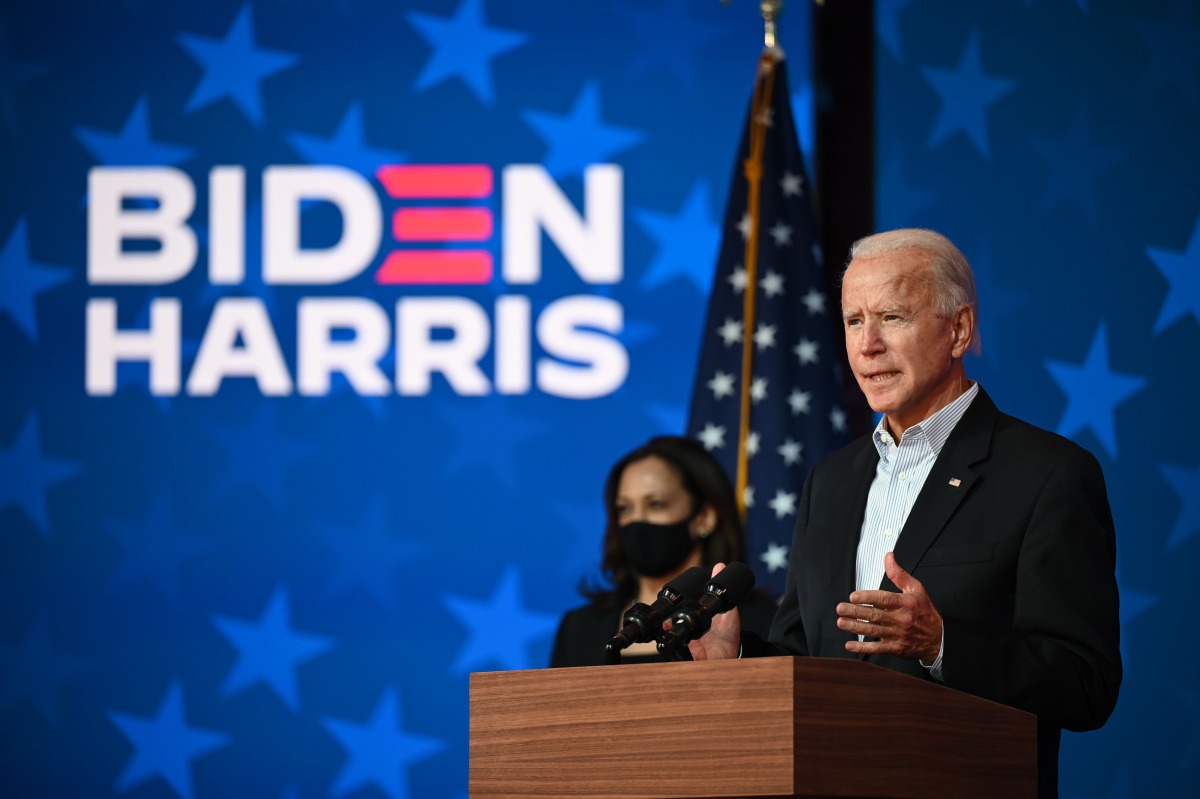 Democratic Presidential candidate Joe Biden speaks as US Senator and Vice-Presidential candidate, Kamala Harris, looks on at the Queen venue in Wilmington, Delaware, on November 5, 2020. The nail-biting US election was on the cusp of finally producing a w