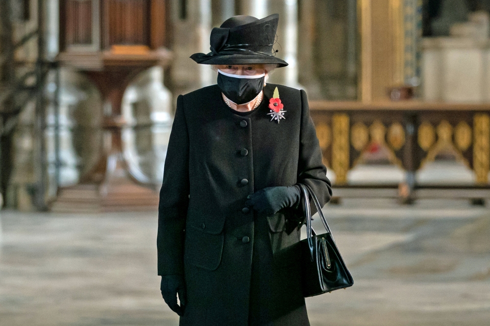 Queen Elizabeth attends a ceremony in London's Westminster Abbey to mark the centenary of the burial of the Unknown Warrior, in Britain November 4, 2020. Picture taken November 4, 2020. Aaron Chown/Pool via REUTERS