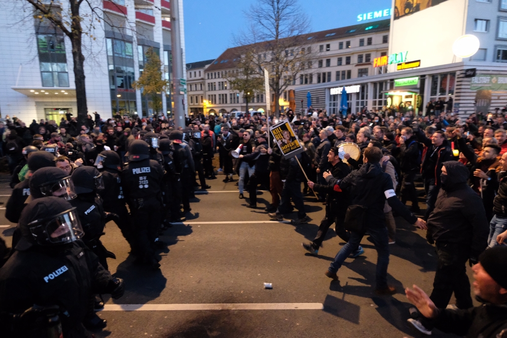 German police face protesters taking part in a demonstration called for by the initiative 