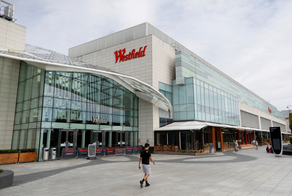 People walk by Westfield shopping centre in Shepherd's Bush, following the outbreak of the coronavirus disease (COVID-19), London, Britain, May 26, 2020. REUTERS/Peter Nicholls/File Photo