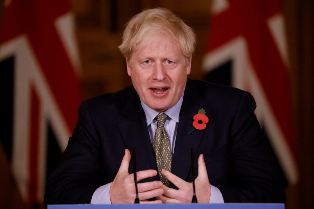 Britain's Prime Minister Boris Johnson speaks during a virtual news conference on the coronavirus disease (COVID-19) pandemic in the UK inside 10 Downing Street in central London, Britain November 9, 2020. Tolga Akmen/Pool via Reuters