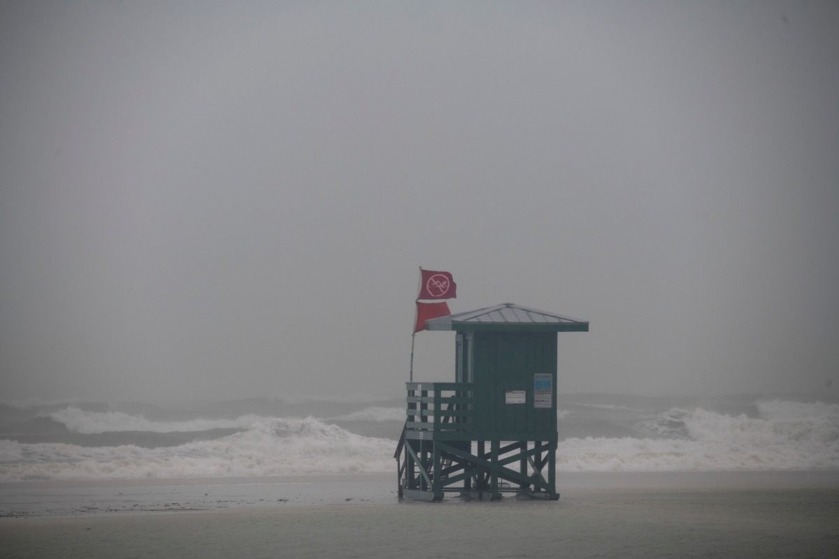 A life guard tower stands in the water covering the entire beach before the arrival of Tropical Storm Eta in Siesta Key, Florida, U.S. November 11, 2020. REUTERS/Ty Wright
