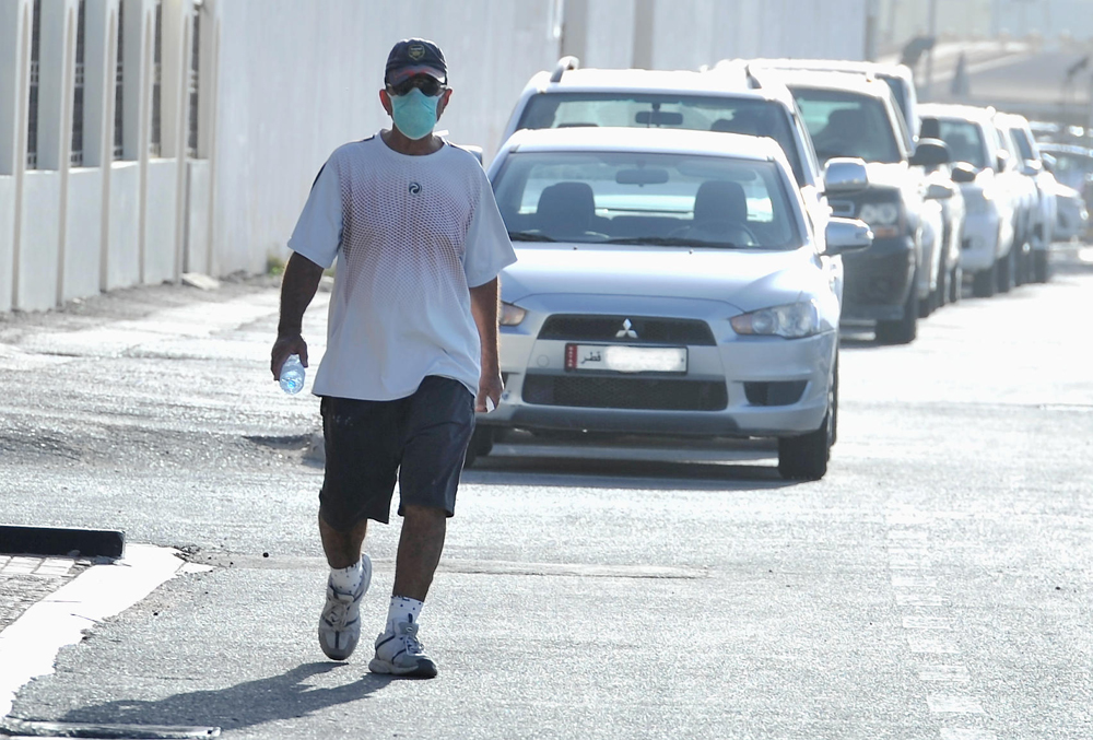 A person wearing mask, following the law, on a Doha road. Picture for representation purpose only. Pic: Salim Matramkot © The Peninsula