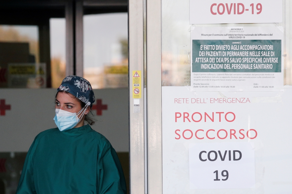 A doctor waits for patients to arrive at the Policlinico Tor Vergata hospital where patients suffering from the coronavirus disease (COVID-19) are being treated in Rome, Italy November 13, 2020. REUTERS/Guglielmo Mangiapane